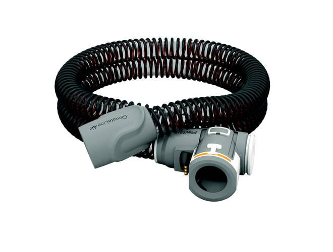 Przewód powietrzny do aparatu CPAP ułożony w spiralę na białym tle.