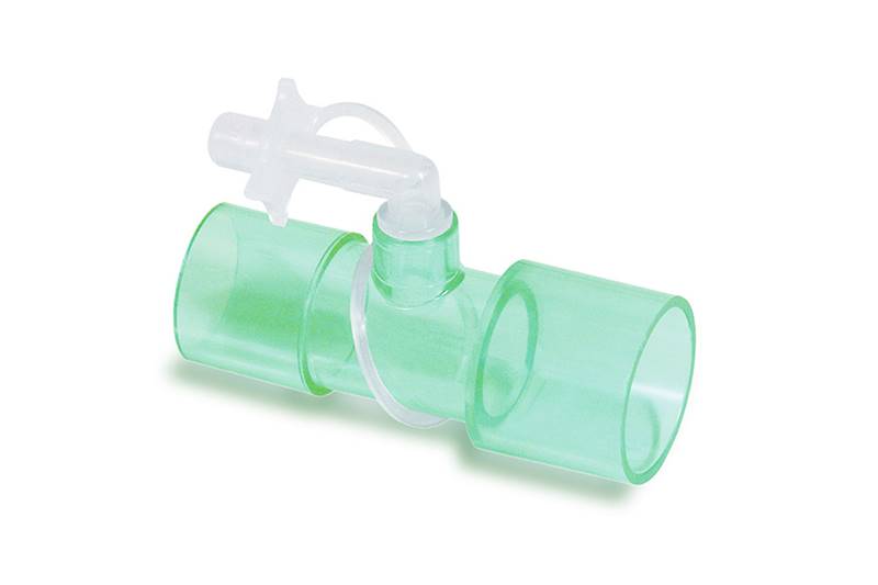 Zielony medyczny łącznik plastikowy do układów oddechowych z bocznym portem i zatyczką.